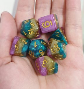 Mollymauk purple teal gold dungeons and dragons polyhedral dice set