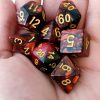 Red and black marble effect dungeons and dragons polyhedral dice set