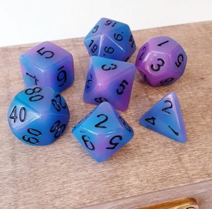 Glow in the dark purple and blue dungeons and dragons polyhedral dice set