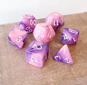 Pink and purple marble effect dungeons and dragons polyhedral dice set