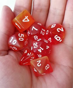 Orange and yellow dungeons and dragons polyhedral dice set