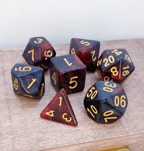 Black and red glitter polyhedral dungeons and dragons dice set