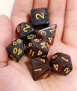 Black and red glitter polyhedral dungeons and dragons dice set