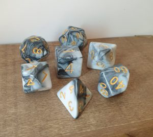Transmute Rock black and white marble effect polyhedral dungeons and dragons dice set