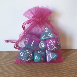 Bermuda II teal and magenta swirled polyhedral dungeons and dragons dice set in magenta bag