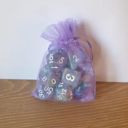 Waterlily dirty pour cool tone polyhedral dungeons and dragons dice set in lilac bag