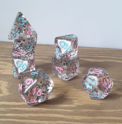 Sprinkles clear resin with pink and blue foil glitter and inked in pink and blue polyhedral dungeons and dragons dice set