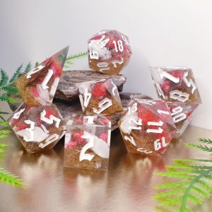 flowers and shell inclusions in soft glittering clear resin sharp edge handmade polyhedral dungeons and dragons dice set
