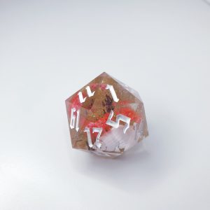 flowers and shell inclusions in soft glittering clear resin sharp edge handmade polyhedral dungeons and dragons dice set
